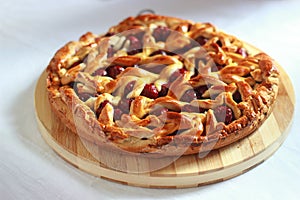 Homemade cherry pie with decorative lattice top