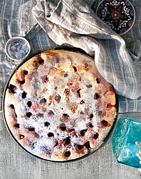 Homemade Cherry pie on round serving board.