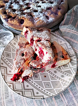 Homemade Cherry pie on round serving board.