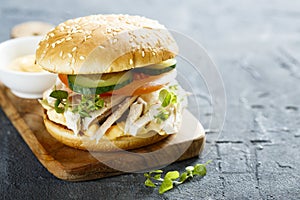 Homemade chicken burger with fresh vegetables
