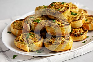 Homemade Chicken Pesto Pinwheels on a Plate, low angle view