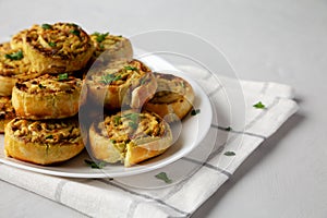 Homemade Chicken Pesto Pinwheels on a Plate, low angle view. Close-up