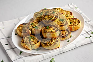 Homemade Chicken Pesto Pinwheels on a Plate, side view