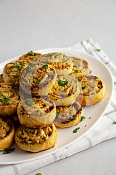 Homemade Chicken Pesto Pinwheels on a Plate, side view. Copy space