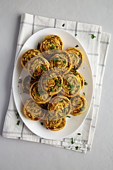 Homemade Chicken Pesto Pinwheels on a Plate, top view. Flat lay, overhead, from above