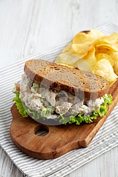 Homemade Chicken Salad Sandwich with Potato Chips, low angle view. Space for text