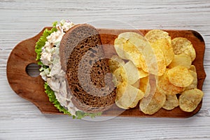 Homemade Chicken Salad Sandwich with Potato Chips, top view. Flat lay, overhead, from above