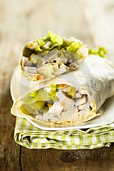 Homemade chicken wraps with gherkins and fresh salad