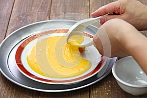 San bu nian, chinese non sticking egg yolk custard pudding photo