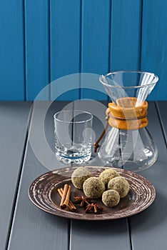 Homemade chocolate bonbons with spices and coffee ware