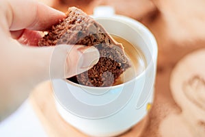 Homemade chocolate brownie with a cup of coffee.