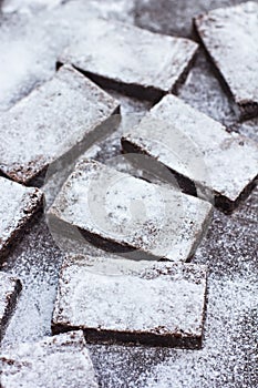 Homemade chocolate brownies on background