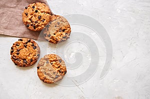 Homemade chocolate chip cookies on a white stone background. Top