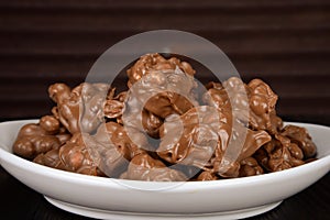 Homemade chocolate covered peanuts photo