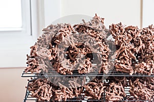 Homemade chocolate haystack cookies on a cooling rack