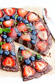 Homemade chocolate natural fruit pizza with berries