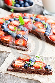 Homemade chocolate natural fruit pizza with berries