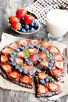 Homemade chocolate natural fruit pizza with berries