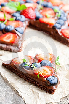 Homemade chocolate natural fruit pizza with berries