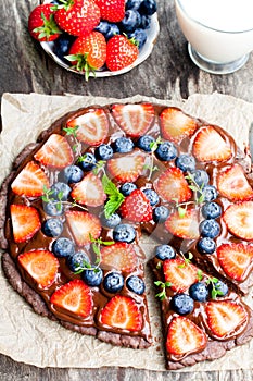 Homemade chocolate natural fruit pizza with berries