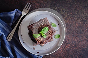Homemade chocolate raw veggie brownies on stone. Sweet desset concept