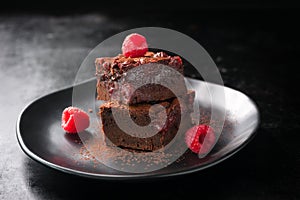 Homemade chocolate sweet brownies cakes with cherry and raspberries