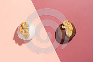 Homemade chocolate truffle. Known as Camafeu in Brazil. Flat design of candy ball on color background.