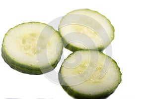 Homemade chopped cucumber.Fresh organic cucumber isolated on white background. File contains clipping path. Full depth of field