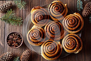 Homemade christmas baking cinnamon rolls buns with spices. Freshly baked. Top view. Festive decoration.