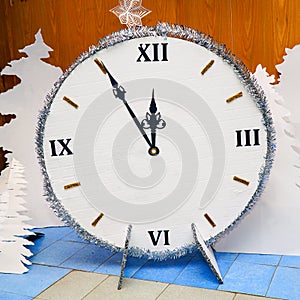 Homemade Christmas clock made of paper or cardboard.