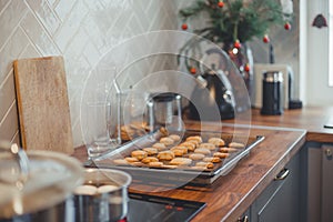 Homemade Christmas cookies on a baking sheet on a wooden table.