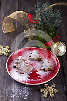 Homemade Christmas cookies in the shape of a Christmas tree, sprinkled with powdered sugar