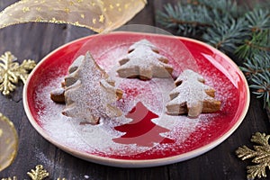 Homemade Christmas cookies in the shape of a Christmas tree, sprinkled with powdered sugar