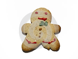 Homemade Christmas gingerbread cooky isolated on white background. Male or female cooky. Decorated Christmas cooky