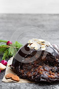 Homemade Christmas pudding on gray stone background