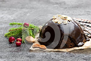 Homemade Christmas pudding on gray stone background
