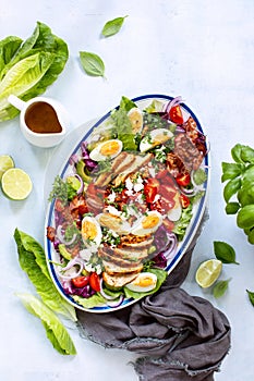 Homemade Cobb salad served in an oval dish