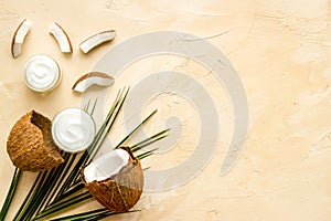 Homemade coconut cream on beige background top-down frame copy space