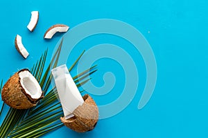 Homemade coconut cream on blue background top-down frame copy space