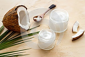 Homemade coconut cream - still life with spoon - on beige background