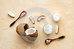 Homemade coconut cream - still life with spoon - on beige background top-down