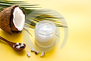 Homemade coconut cream - still life with spoon - on yellow background