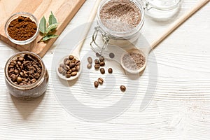 Homemade coffee-sugar scrub top view wooden background