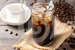 homemade cold-brew coffee in a mason jar with a metal straw