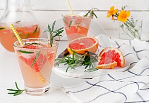 Homemade cold lemonade of grapefruit and rosemary. Antioxidant drink