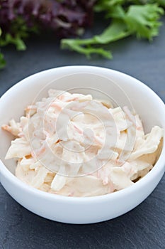 Homemade coleslaw in a white bowl