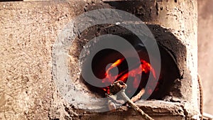 Homemade concrete wood fired stove in the dirty kitchen