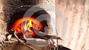 Homemade concrete wood fired stove in the dirty kitchen