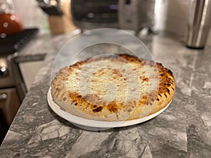 A homemade cooked pizza
