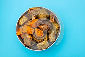 Homemade Cooked Sweet Potato with spices and herbs in smal bowl